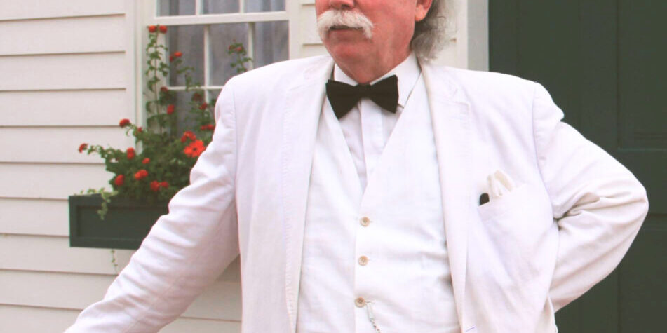 Actor Richard Garey portraying Mark Twain in front of the Boyhood Home